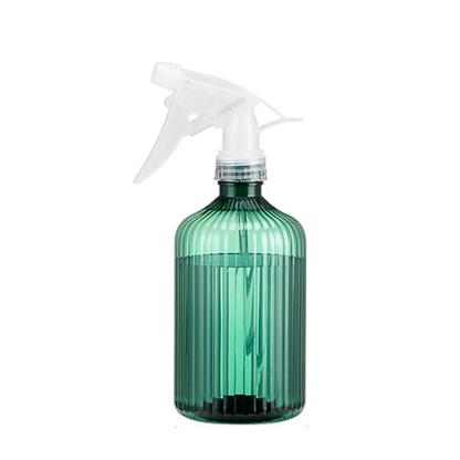 Transparent green spray bottle