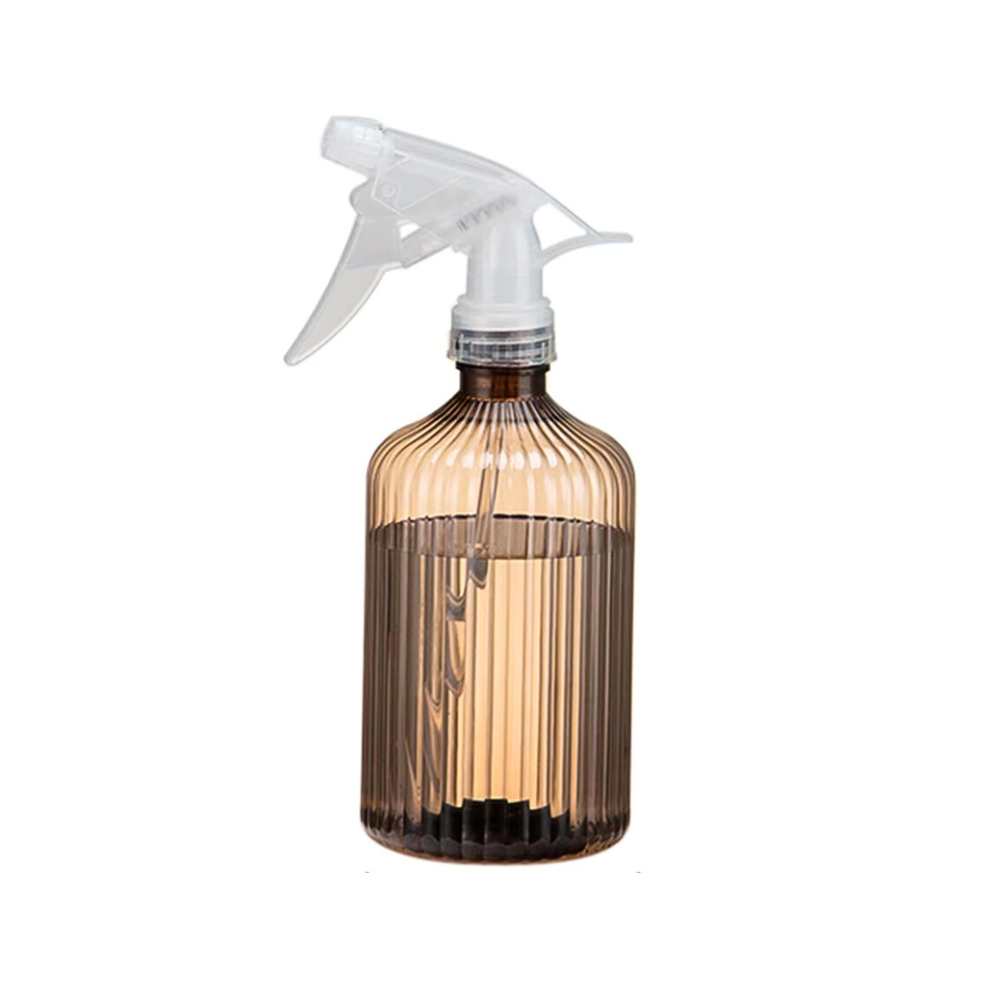 Transparent brown spray bottle