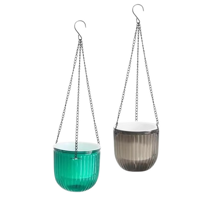 Two self-watering hanging planters for indoor plants in transparent green and transparent grey