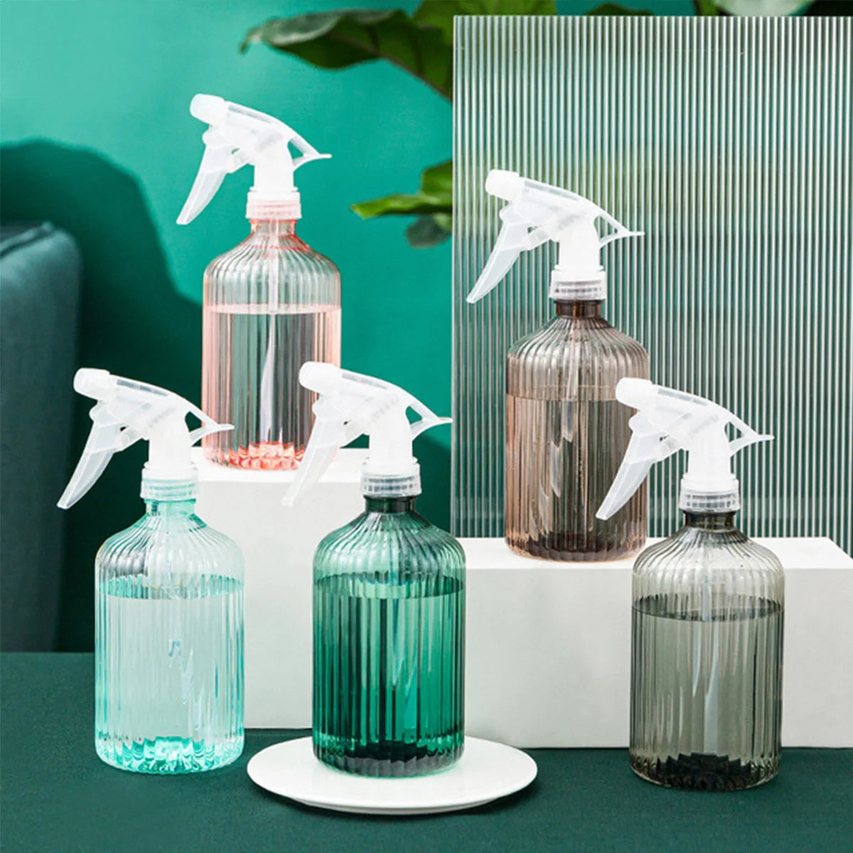 Transparent, modern spray bottles for indoor plant